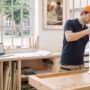 Blum TANDEMBOX drawer system open in a real kitchen cabinet showing soft-close hardware in use