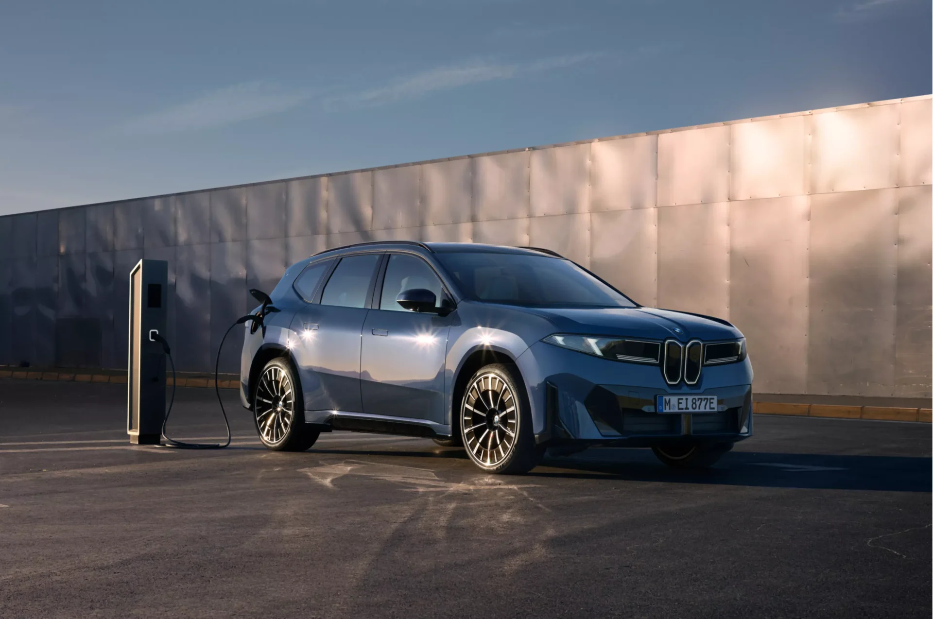 BMW iX3 charging at a public DC fast-charging station