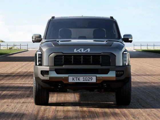 Kia Tasman front three-quarter view on an outback dirt track
