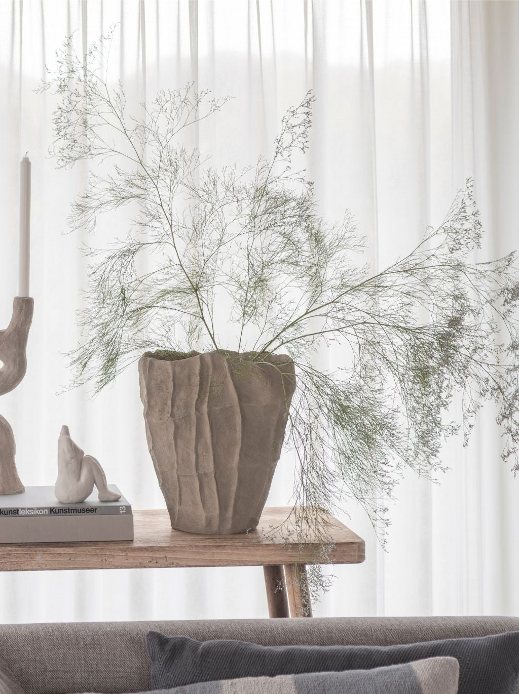 Mette Ditmer Art Piece Artistic Vase on a bench in a styled living space