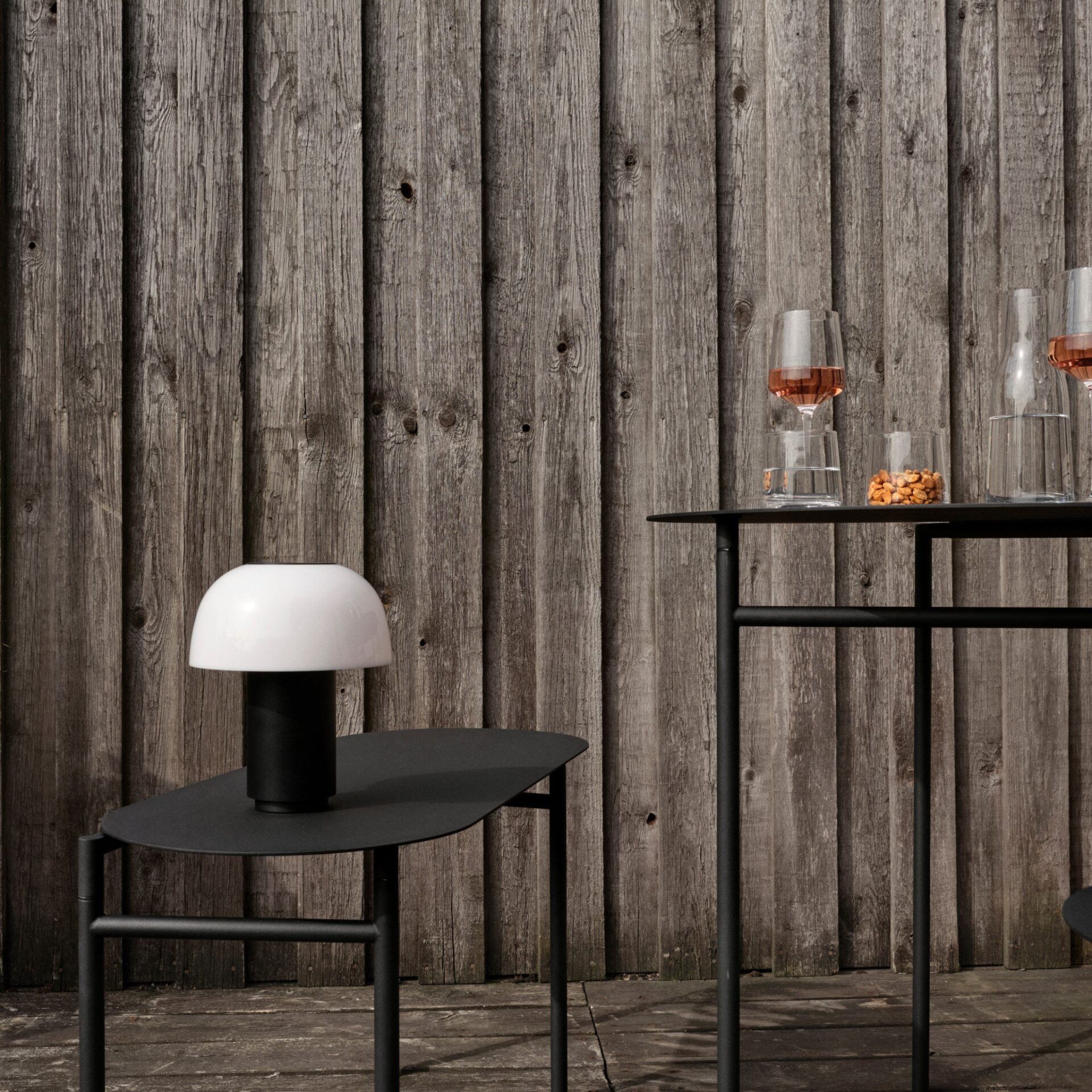 Zone Denmark Harvest Moon Lamp in black on a side table