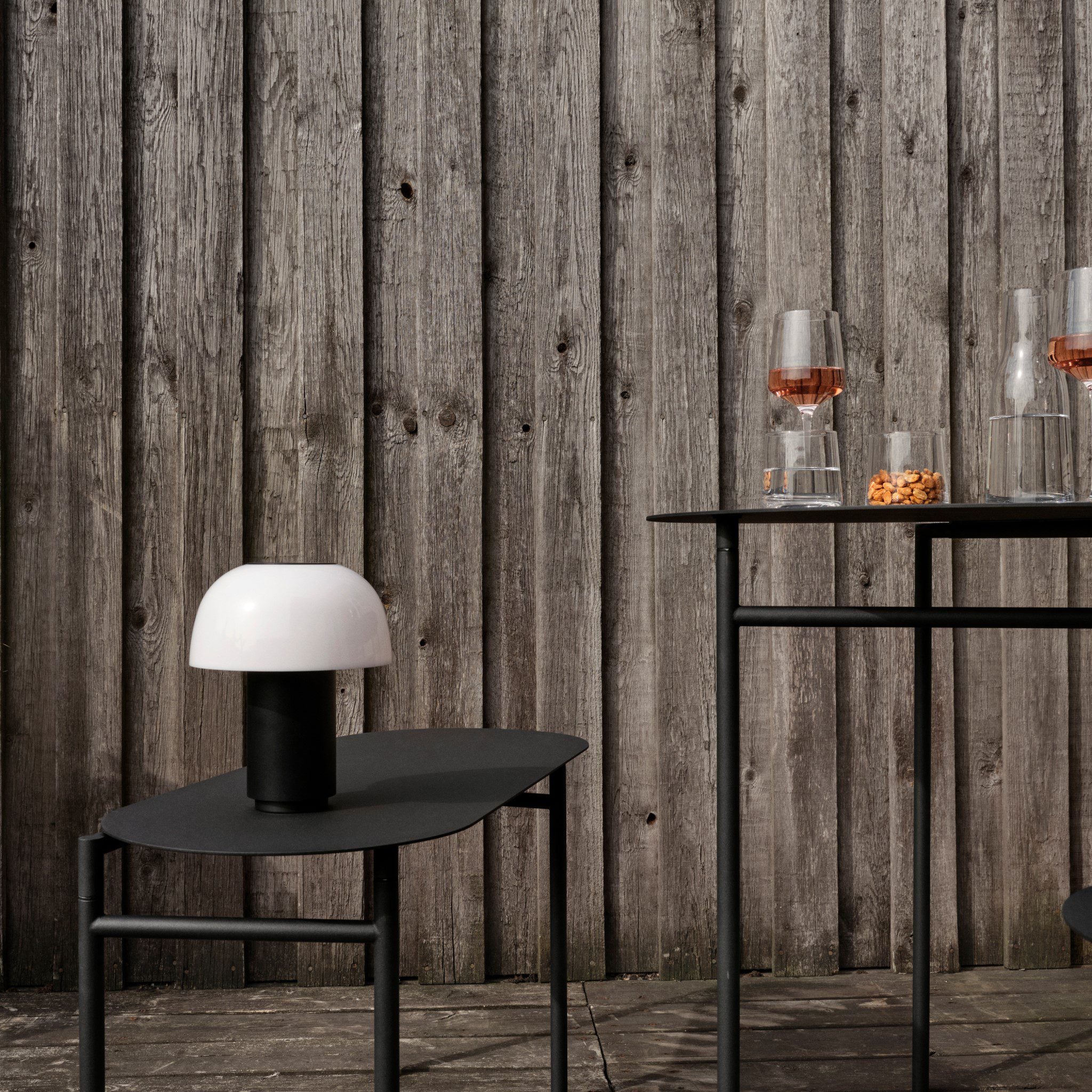 Zone Denmark Harvest Moon Lamp: A Portable Glow Shaped Like Its Name 1 Zone Denmark Harvest Moon Lamp in black on a side table